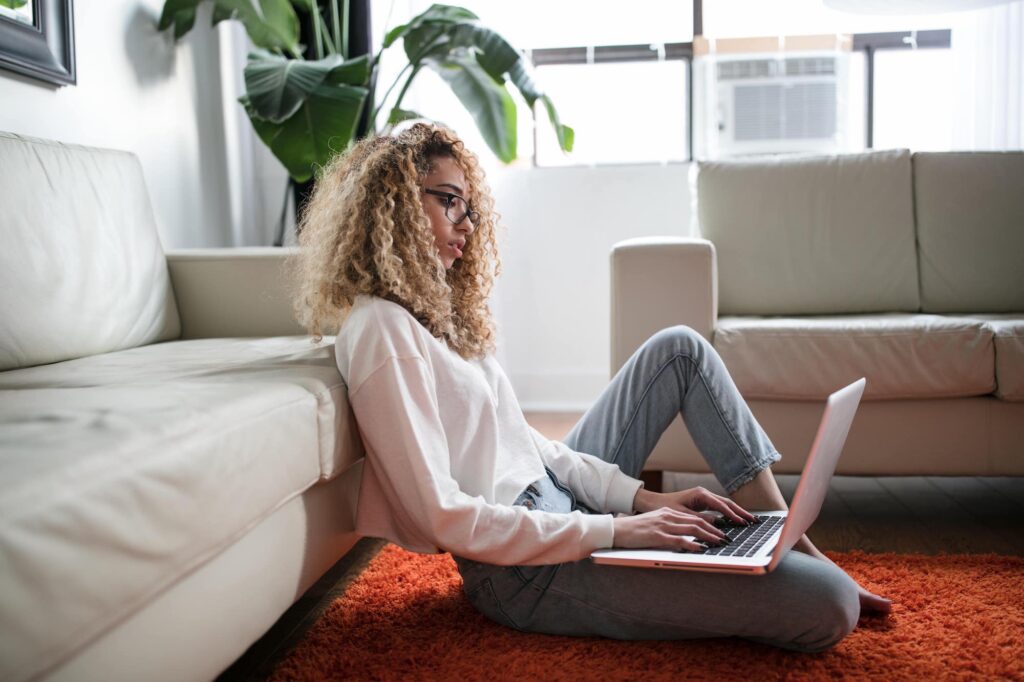female-professional-using-laptop-in-comfy-setting