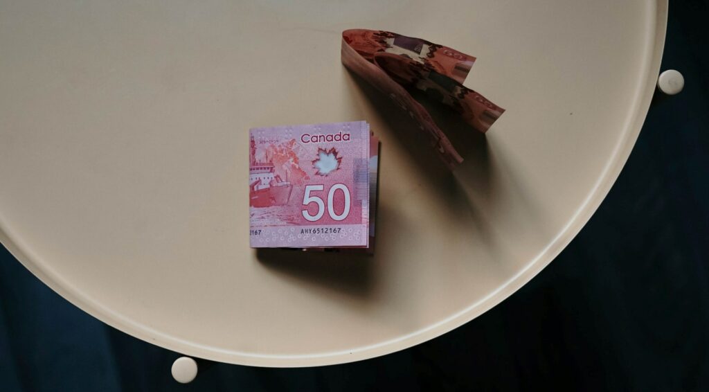 Canadian-fifty-dollar-bills-folded-on-table